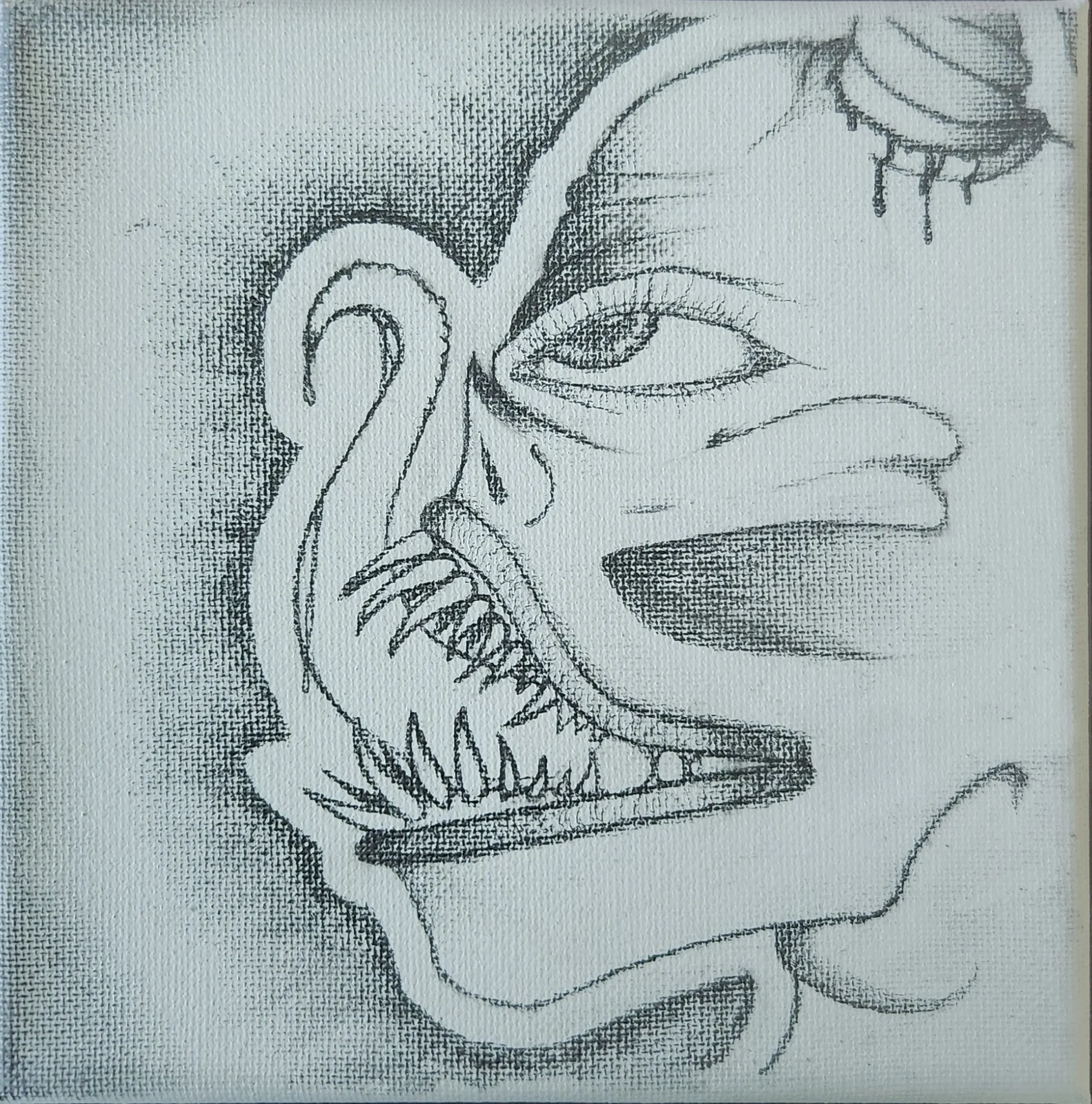 Pencil drawing on canvas of a fanged face in profile