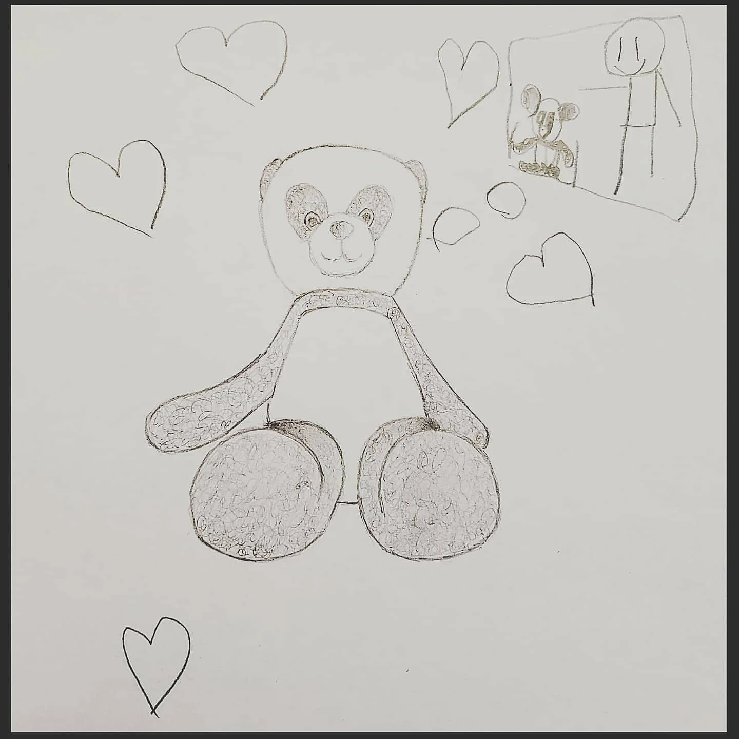 Pencil drawing of a teddy bear surrounded by hearts, with a small mirror scene sketched beside it